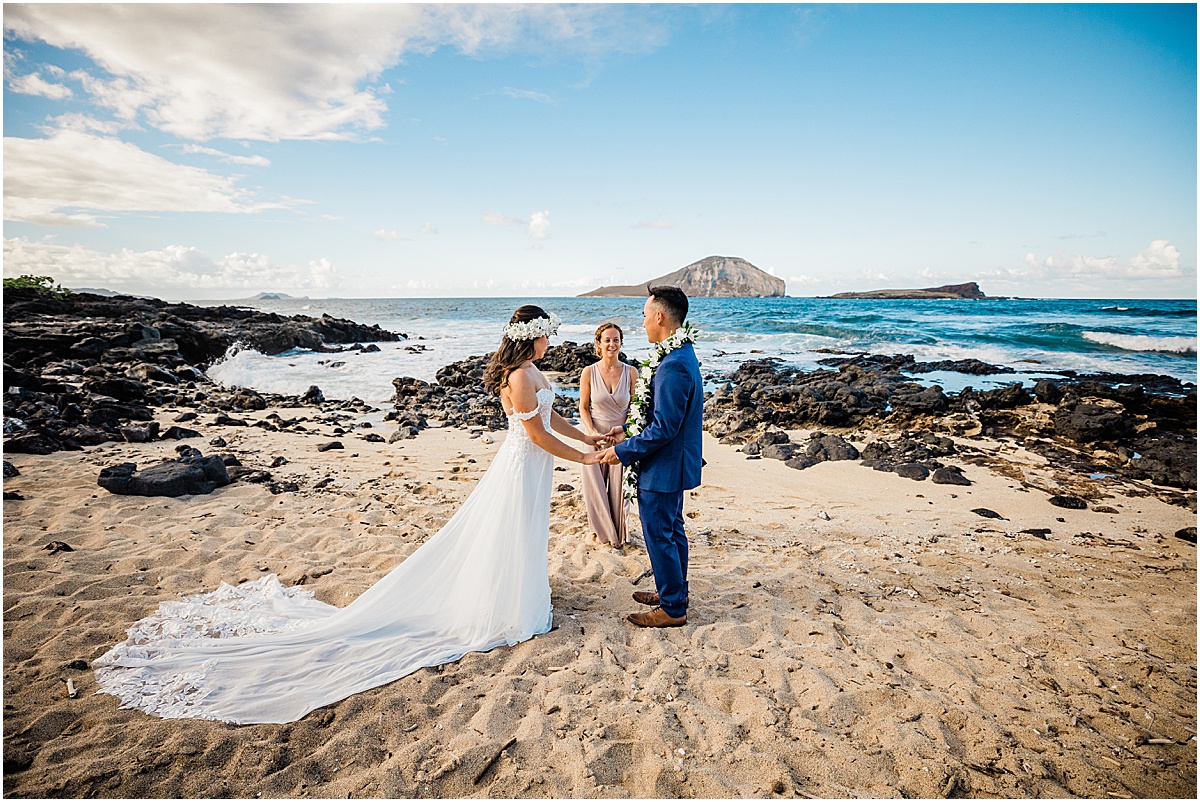 bride, groom, and officiant in hawaii beach wedding