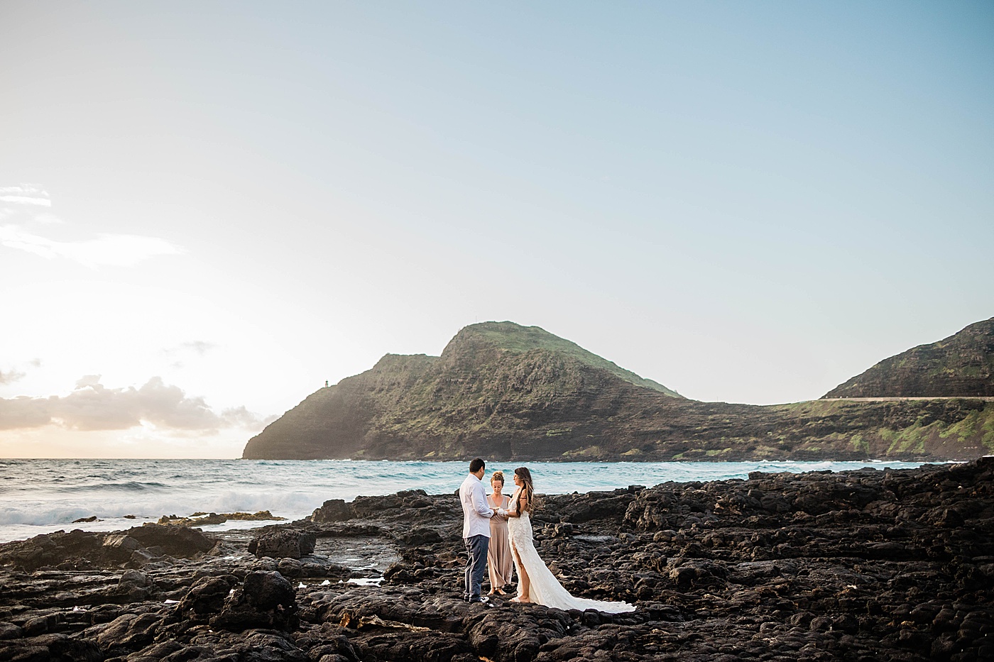 bride, groom, and officiant during honolulu elopement ceremony