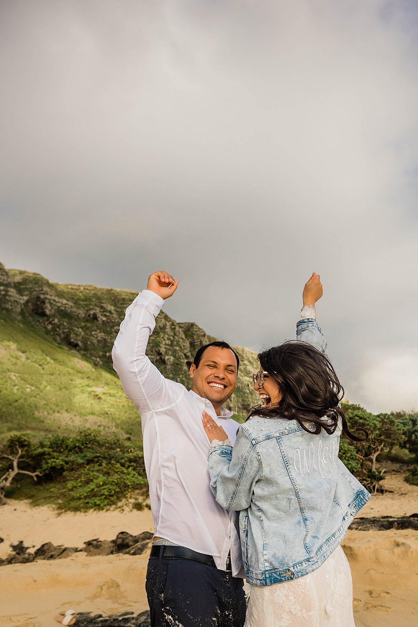 bride and groom celebrating after honolulu elopement ceremony