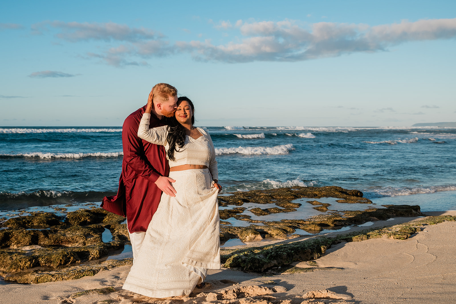 Sunset beach ceremony during an all-inclusive elopement in Hawaii with photographer capturing moments